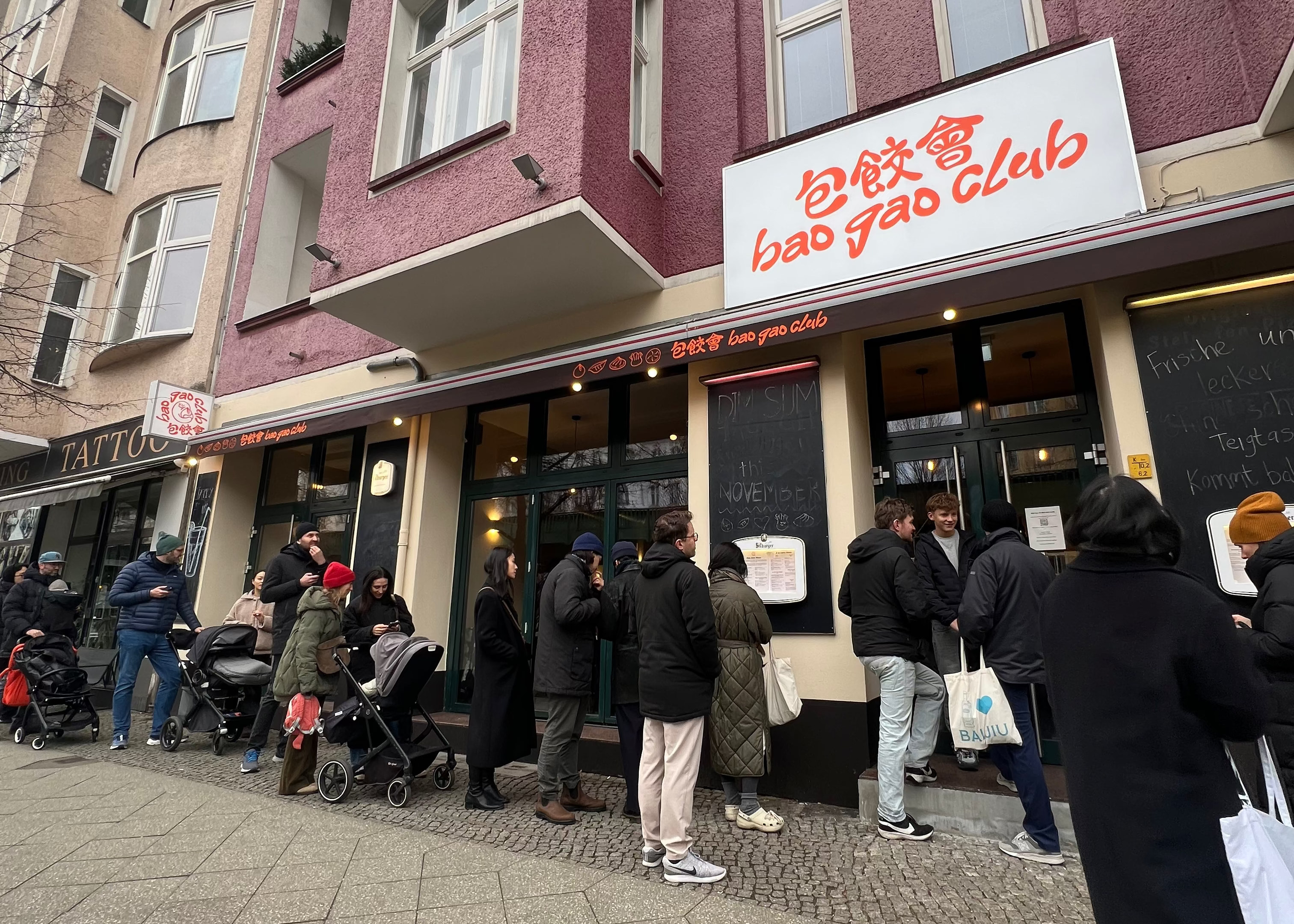 People queuing outside of the new Bao Gao Club restaurant